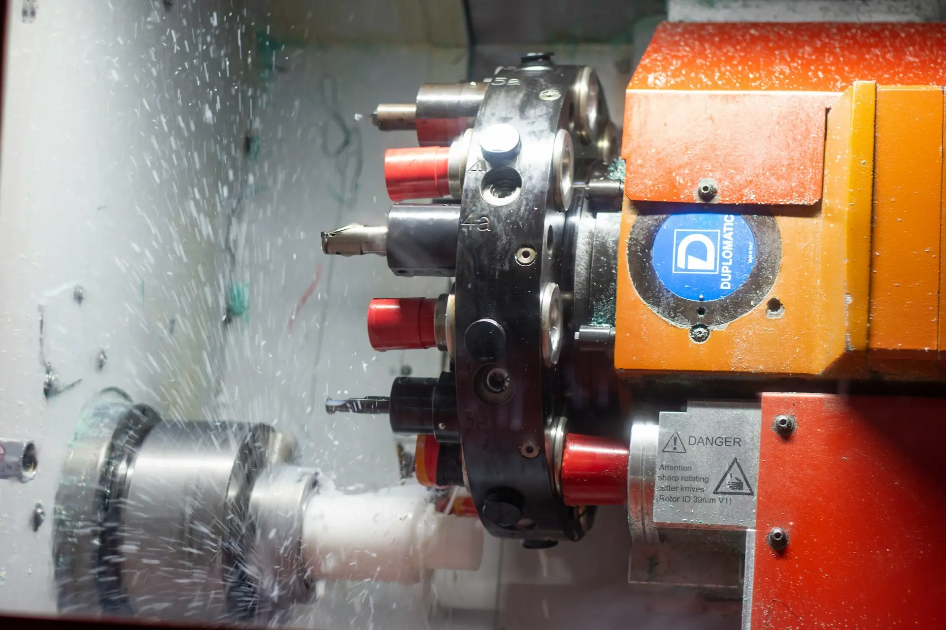a close up of a machine cutting a piece of metal